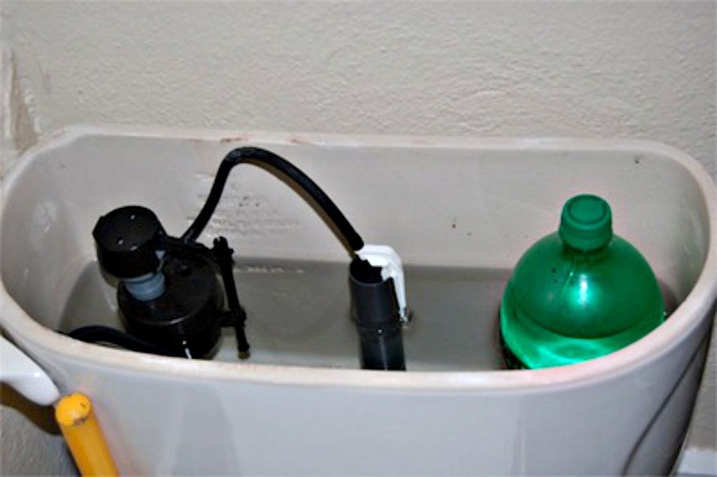 Soda bottle in the toilet tank