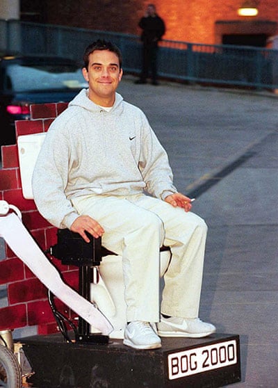 Robbie Williams riding toilet